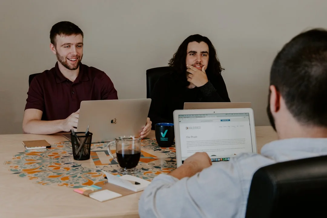 Overhead shot of diverse team analyzing marketing strategies with charts and graphs.